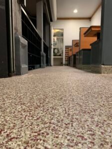 Close Up Picture Of A Epoxy Flake Floor In A Restaurant with Booths